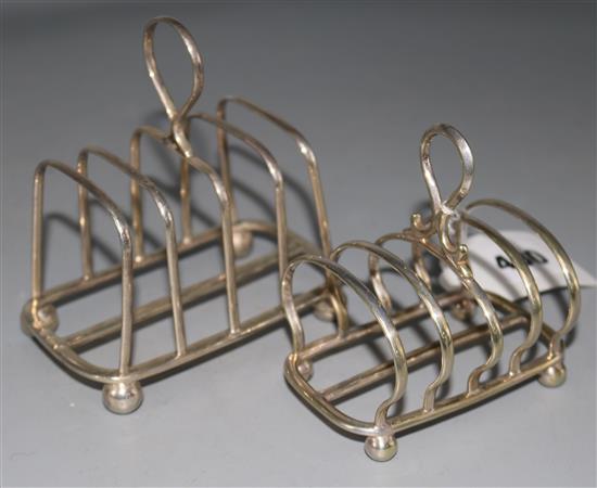 One silver five bar toastrack and one plated five bar toastrack.